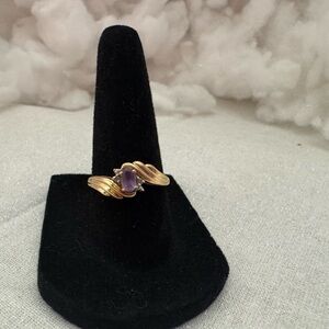 10k gold ring with purple stone , size 7.25